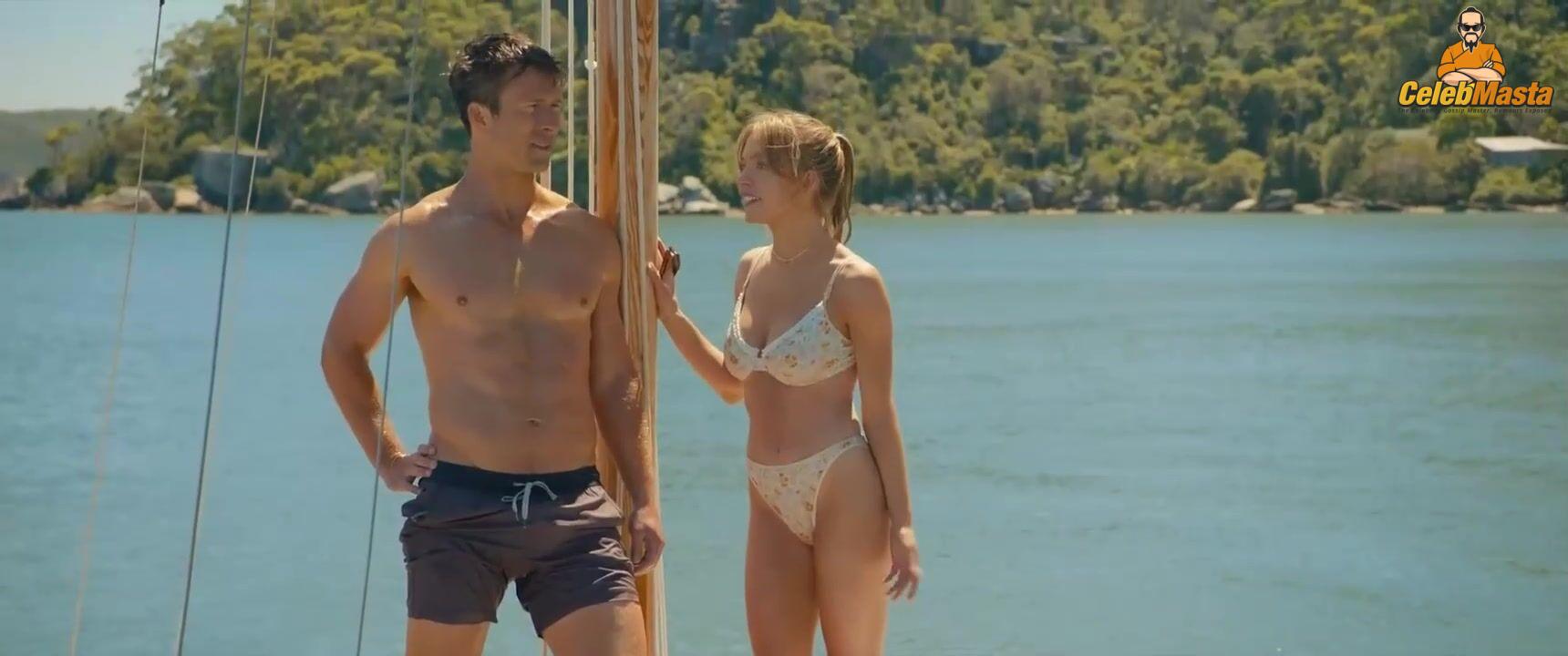 Sydney Sweeney nearly nude sheer outfit appearance. Sydney Sweeney revealing cleavage in just bra and panties showing her sexy curves.