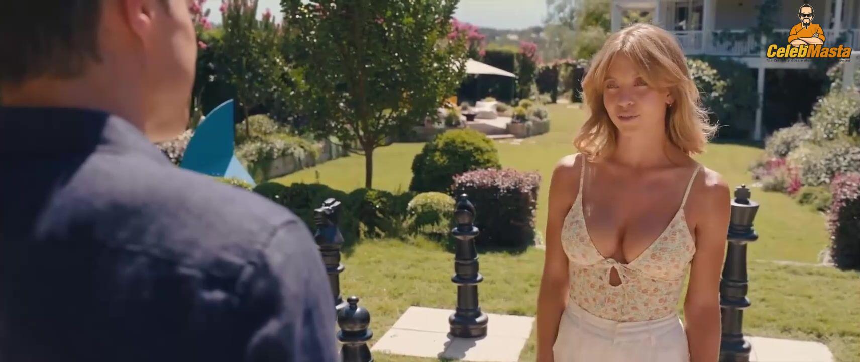 Sydney Sweeney nearly nude sheer outfit appearance. Sydney Sweeney revealing cleavage in just bra and panties showing her sexy curves.