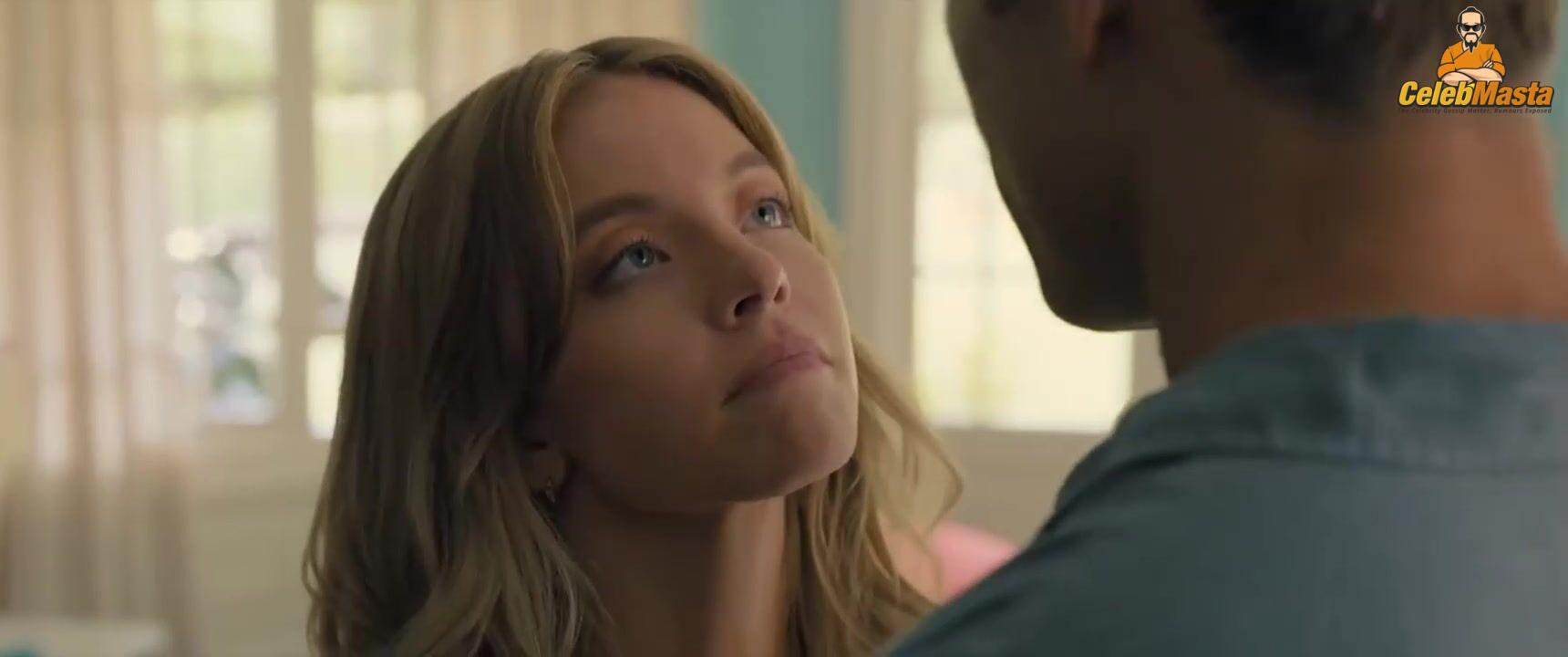 Sydney Sweeney nearly nude sheer outfit appearance. Sydney Sweeney revealing cleavage in just bra and panties showing her sexy curves.