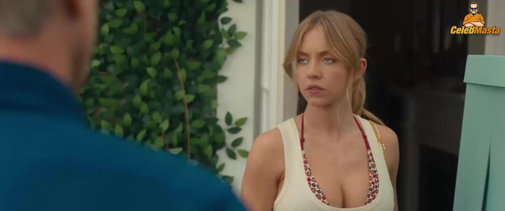 Sydney Sweeney nearly nude sheer outfit appearance. Sydney Sweeney revealing cleavage in just bra and panties showing her sexy curves.
